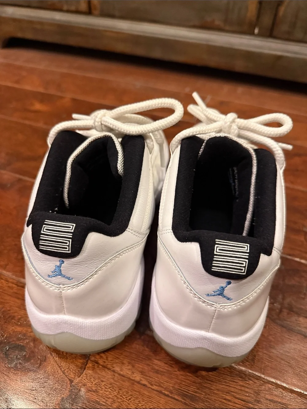 Jordan Men's White and Black Low-Top Sneakers with Blue Tongue Accent